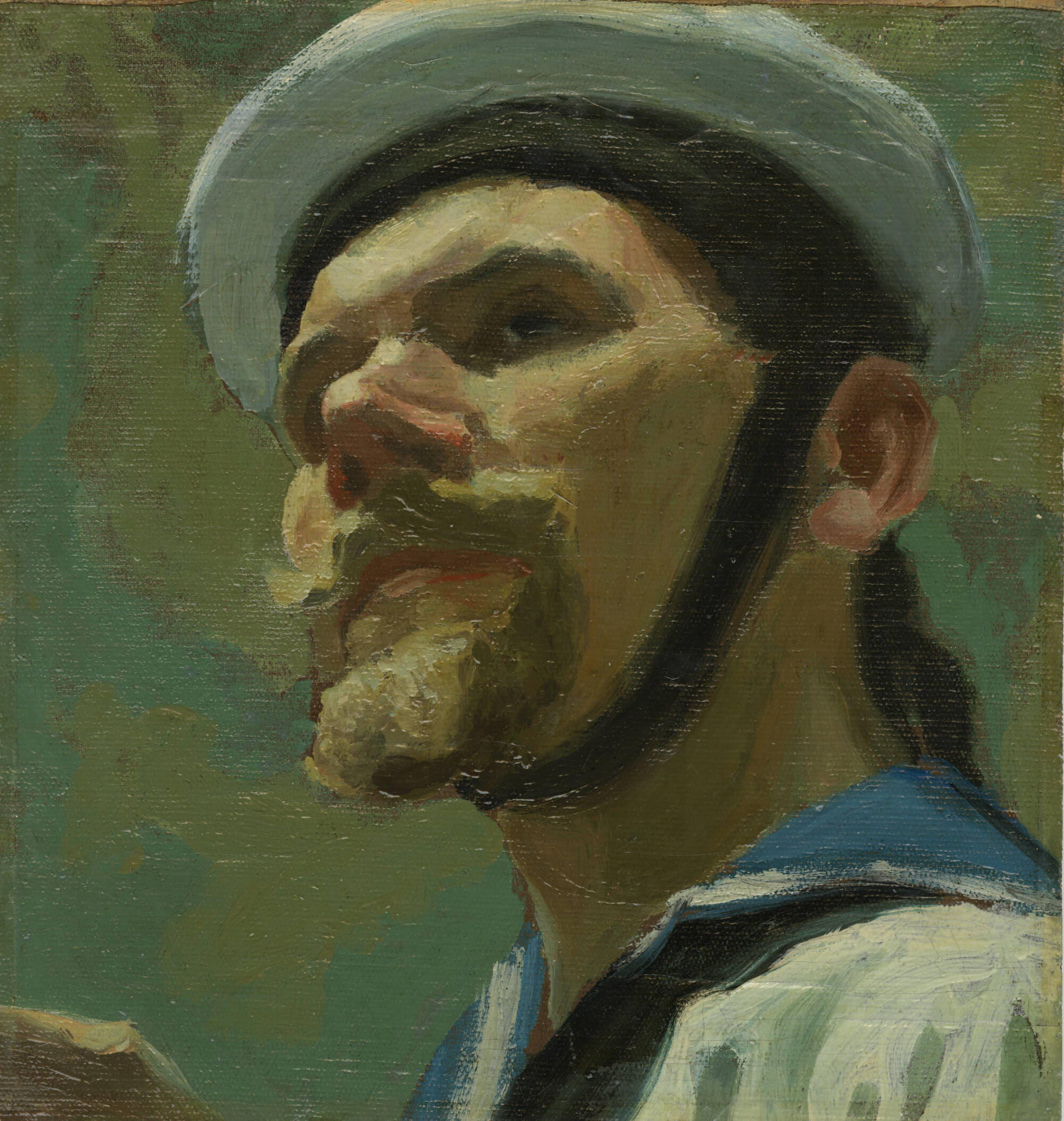 Portrait of a man with a goatee, wearing a hat or helmet with a strap under his chin.